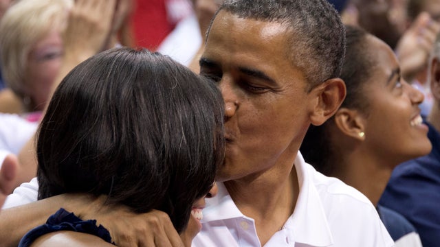 President Barack Obama kisses his wife 