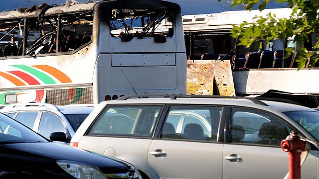 Destroyed buses are seen at Burgas airport, outside the Black Sea city of Burgas, Bulgaria, some 250 miles east of the capital, Sofia, Wednesday, July 18, 2012.  