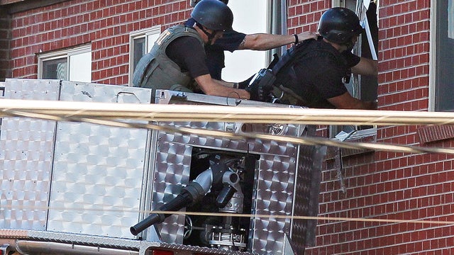 At least 14 dead at Batman premiere shooting 