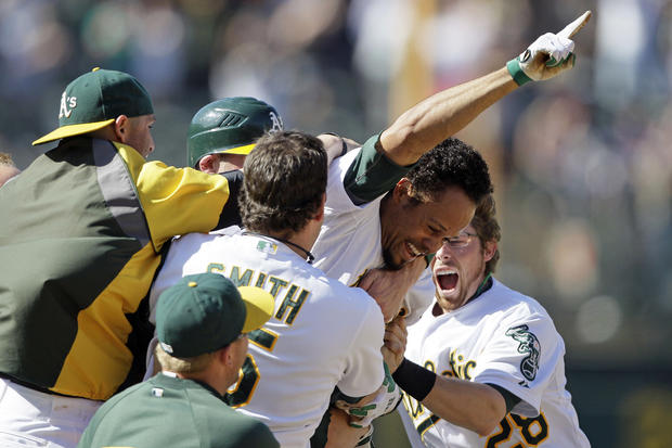 Coco Crisp is mobbed by teammates  