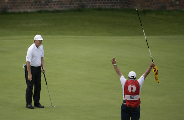 Ernie Els of South Africa reacts after putting on the 18th green 