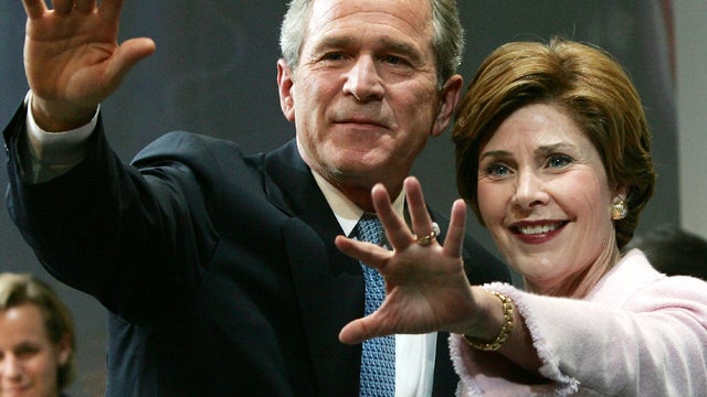 President George W. Bush and first lady Laura Bush acknowledge supporters at the Ronald Reagan Building Nov. 3, 2004, in Washington. 