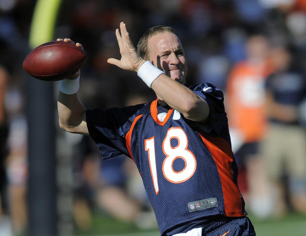 Peyton Manning throws  