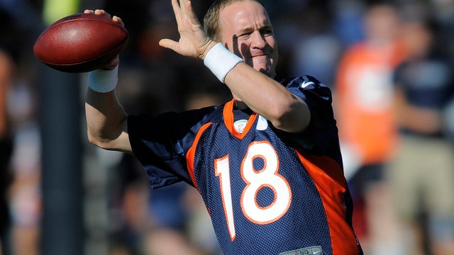 Peyton Manning throws  