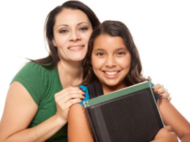 Hispanic Mother and Daughter Ready for School Isolated on a White Background. 