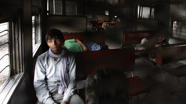 Passengers on a train stuck in a New Delhi station during a power outage 