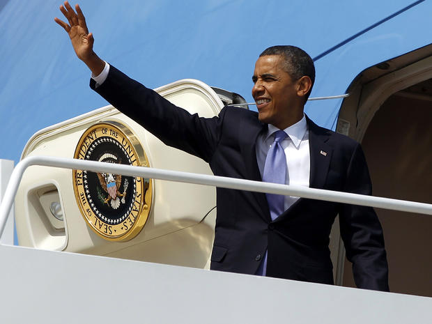 President Obama waves as he boards Air Force One before his departure from Andrews Air Force Base, Md., July 30, 2012. 