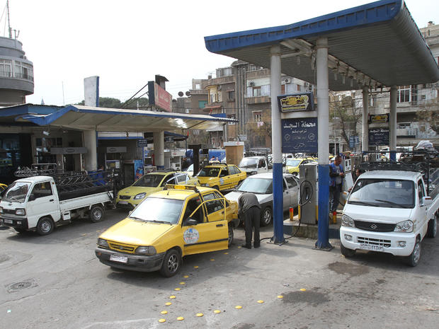 Vehicles line up at a gas station in Damascus 