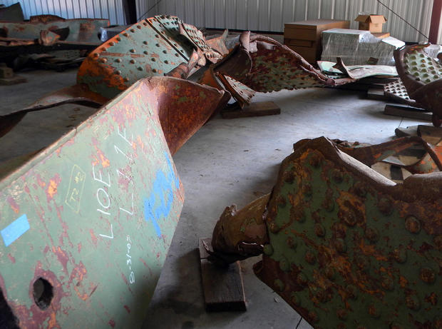 Rusting beams from the Interstate 35W bridge that collapsed Aug. 1, 2007 in Minneapolis are seen on the floor of a Minnesota transportation department garage in Oakdale, Minn. on Tuesday, July 31, 2012. 