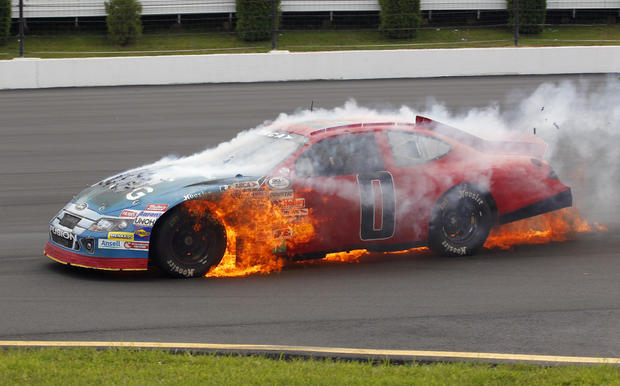 Don Thompson drives his burning car 