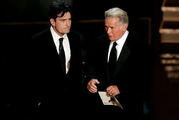 Actors Charlie Sheen, left, and his dad Martin Sheen onstage at the 58th Annual Primetime Emmy Awards  on Aug. 27, 2006, in Los Angeles. 