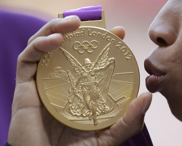 United States' Allyson Felix kisses the gold medal for the women's 200-meter  