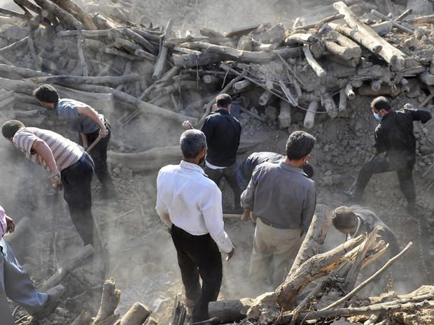 Iranians search ruins in Bajebaj village 