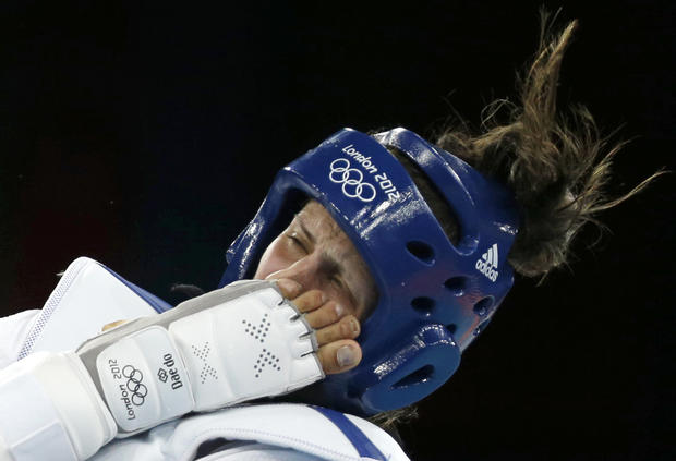 Jordan's Nadin Dawani is kicked in the face by Ukraine's Maryna Konieva  