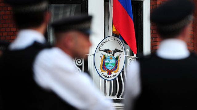 Police officers stand outside the Ecuadorian Embassy in London Aug. 19, 2012. 