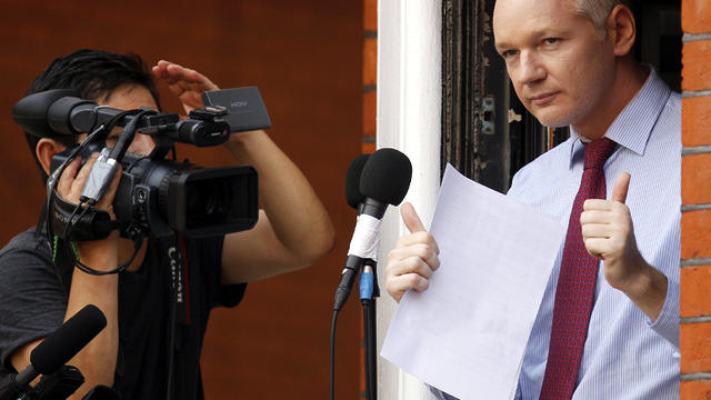 WikiLeaks founder Julian Assange gestures after his statement to the media and supporters on a balcony of the Ecuadorian Embassy in London Aug. 19, 2012. 