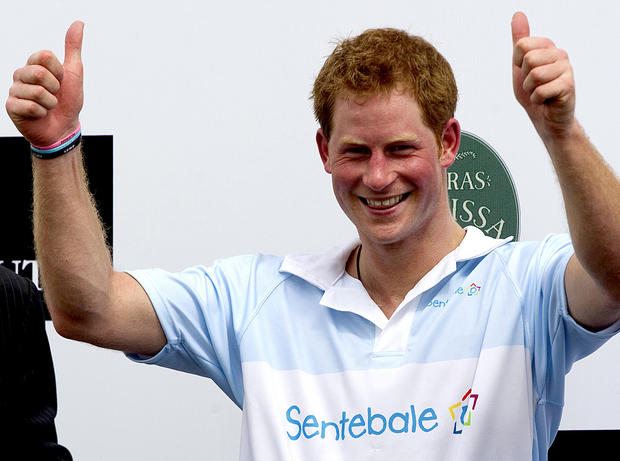 Britain's Prince Harry gives a thumbs up during the award ceremony after playing a charity polo match in Campinas, Brazil,  March 11, 2012.  