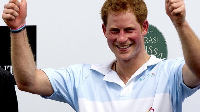 Britain's Prince Harry gives a thumbs up during the award ceremony after playing a charity polo match in Campinas, Brazil,  March 11, 2012.  