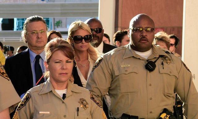 Paris Hilton poses with her customized t-shirt by 'Shout Out' 