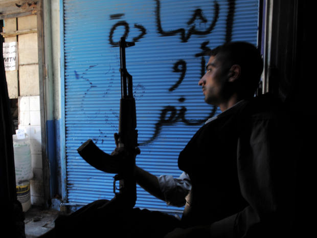 A Syrian rebel sits in a van in Aleppo 