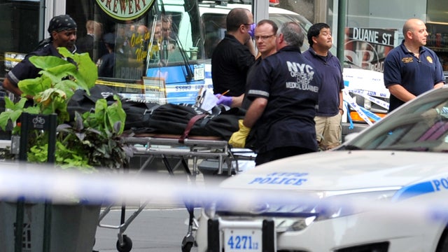 Investigators remove body of man they say was gunman from outside Empire State Building Friday 