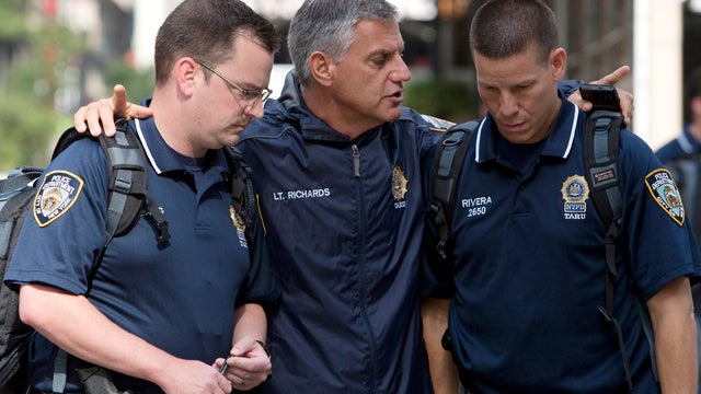 New York City police officers talk at the scene of a shooting near the Empire State Building Aug. 24, 2012, in New York City. 