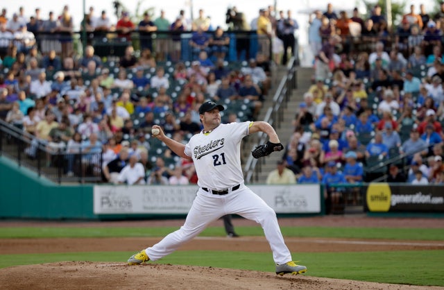 Roger Clemens throws a pitch during a baseball game 