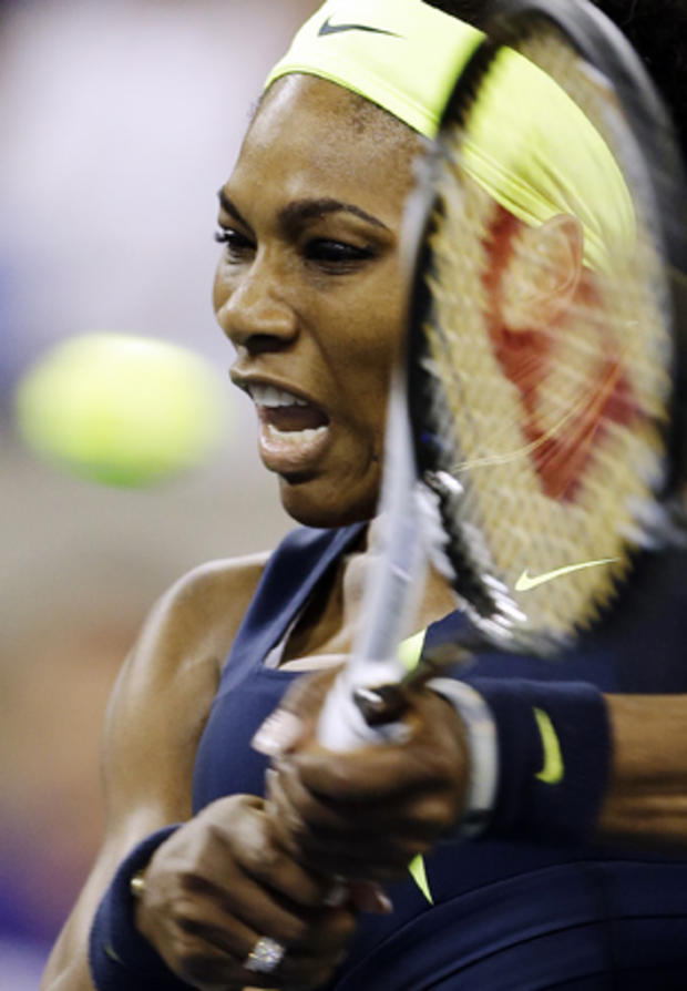 Serena Williams returns a shot 
