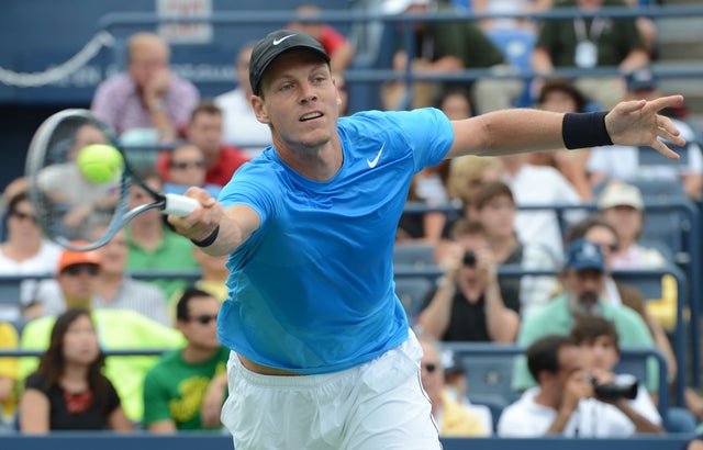 Tomas Berdych returns a shot to Spain's Nicolas Almagro  