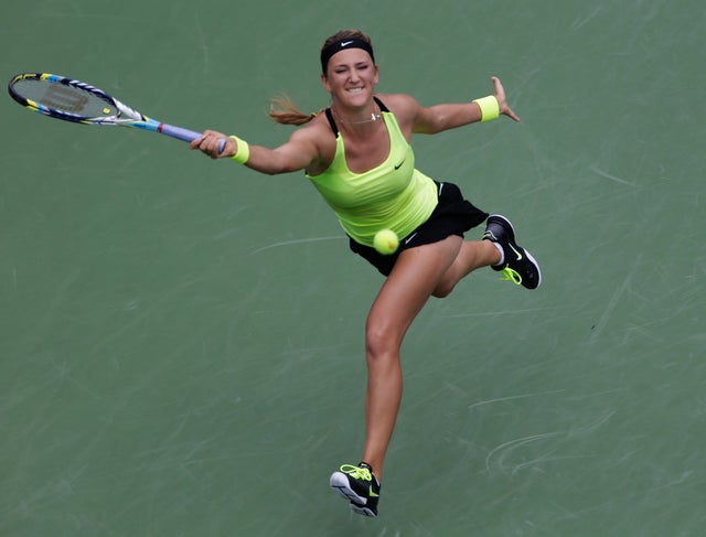 Victoria Azarenka returns a shot to Samantha Stosur 
