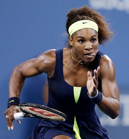 Serena Williams chases down a shot  