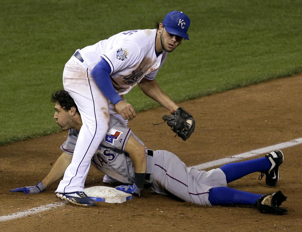 Ian Kinsler beats the tag by Mike Moustakas 