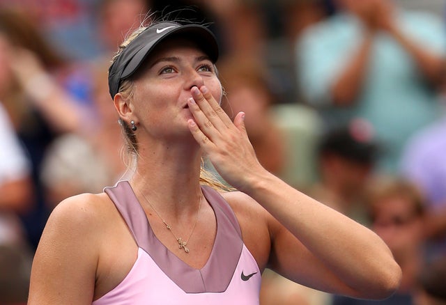 Maria Sharapova of Russia reacts after defeating Marion Bartoli  
