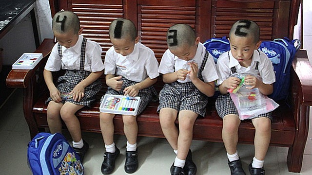 A mother from Shenzhen, south China's Guangdong Province, had her 6-year-old quadruplet sons get distinguishing haircuts before they started school for their first time.  