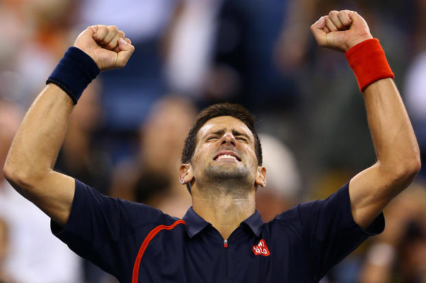 Novak Djokovic celebrates match point during his men's singles quarterfinal 