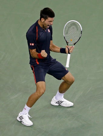 Novak Djokovic reacts after winning the second set against Juan Martin del Potro 