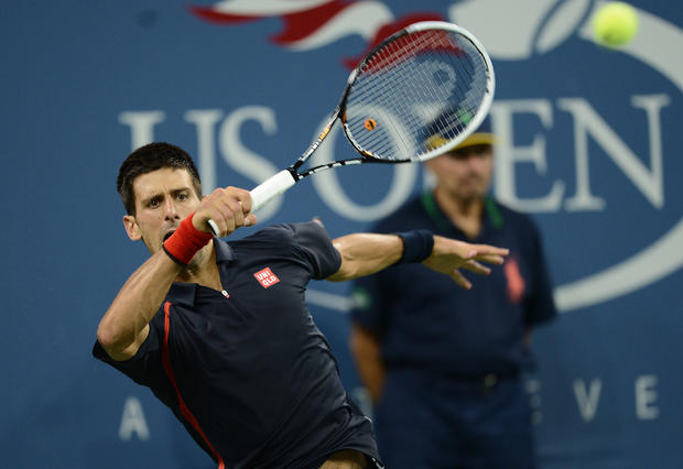Novak Djokovic plays a point 