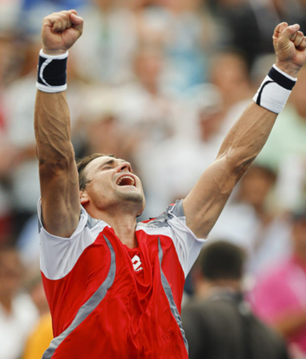 David Ferrer of Spain reacts after defeating Janko Tipsarevic 