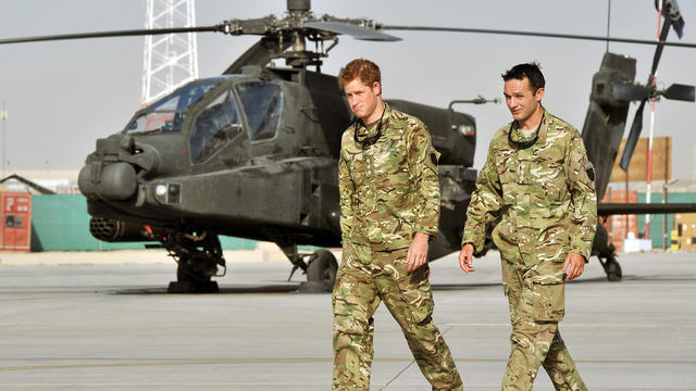 Britain's Prince Harry is shown with an unidentified member of his squadron at Camp Bastion 