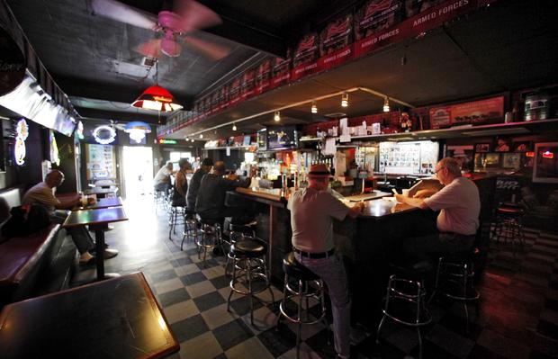 Patrons enjoy a drink at the King Eddy Saloon, one of the oldest and most colorful dive bars in Los Angeles. 