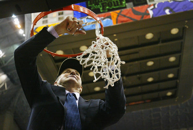 Jim Calhoun of the UConn Huskies celebrates by cutting down the net  