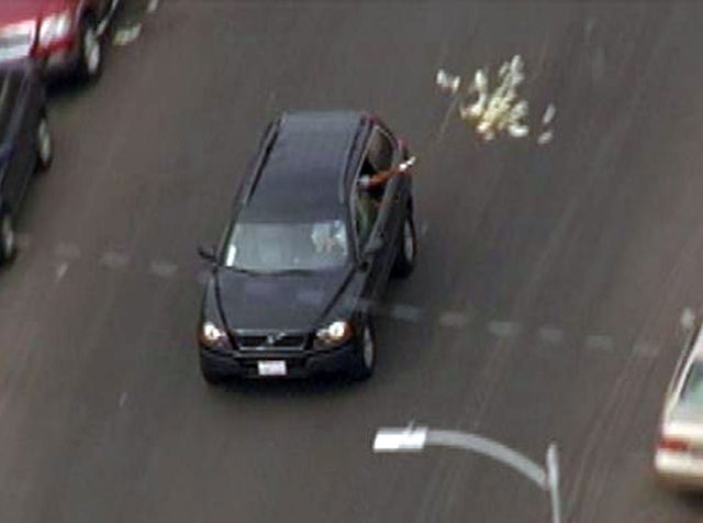 Bank robbery suspects toss cash from SUV as it's being chased by sheriff's deputies through L.A. streets Wednesday 