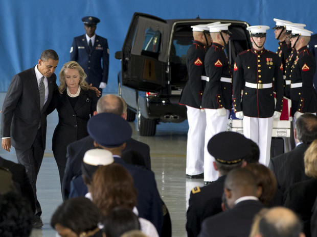 President Obama and Secretary of State Hillary Rodham Clinton walk back to their seats after speaking during a transfer of remains ceremony Sept. 14, 2012, at Andrews Air Force Base, Md., marking the return to the United States of the remains of four Americans killed in Benghazi, Libya. 