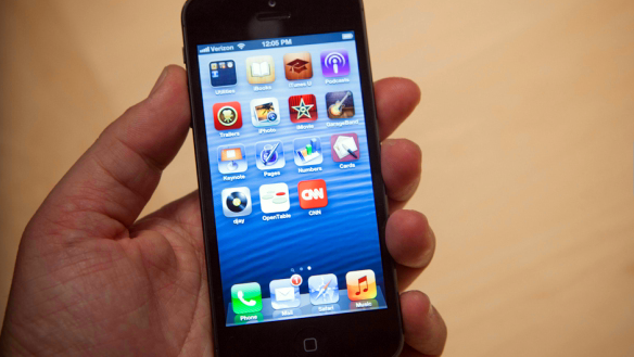 The iPhone 5 in hand. 