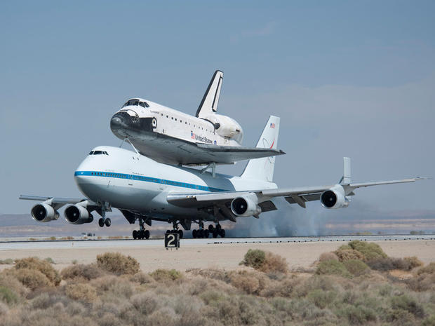 NASA's Shuttle Carrier Aircraft with the space shuttle Endeavour securely mounted on top touches down at Edwards Air Force Base after third leg of its four-segment final ferry flight from the Kennedy Space Center in Florida to Los Angeles International Airport on Sept. 20, 2012. The landing was preceded by a spectacular low-level flyby of NASA Dryden Flight Research Center and the Edwards flight line flown by NASA Dryden pilot Bill Brockett. Photo Credit: (NASA/Tom Tschida) 
