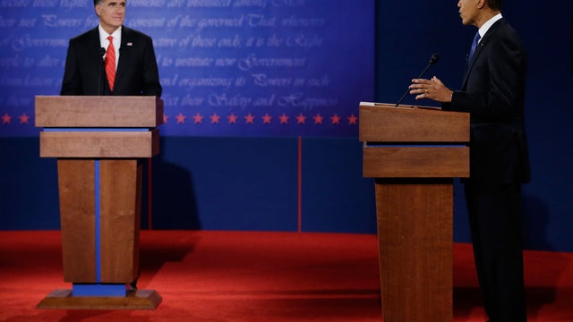 Republican presidential nominee Mitt Romney, left, listens to President Barack Obama during the first presidential debate 