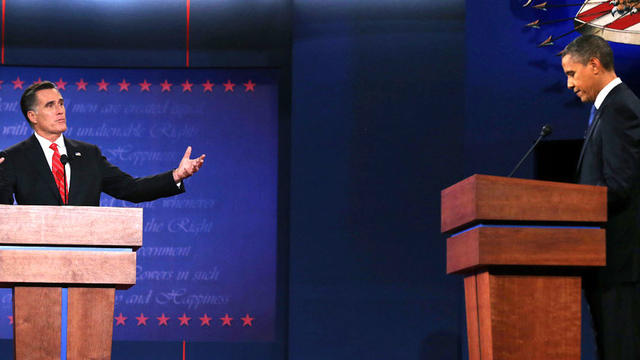 Republican presidential candidate, former Massachusetts Gov. Mitt Romney (L) speaks as Democratic presidential candidate, U.S. President Barack Obama (R) listens during the Presidential Debate at the University of Denver on October 3, 2012 in Denver, Colo 