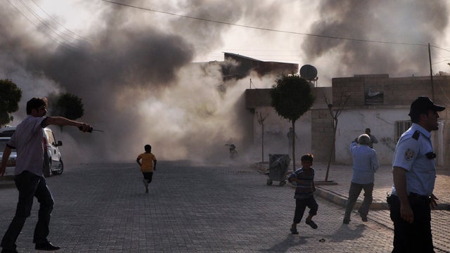 Smoke rises from where several shells hit the village of Akcakale 