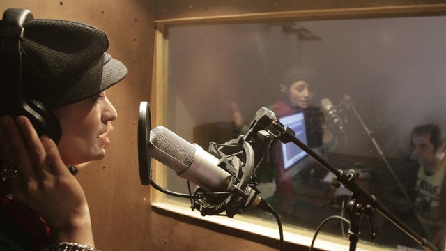 Afghanistan's first female rapper Sosan Firooz sings in a studio in Kabul, Afghanistan, in this Wednesday, Oct. 3, 2012 photo. 