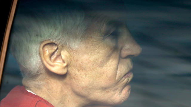 Former Penn State University assistant football coach Jerry Sandusky is driven from the Centre County Courthouse after being sentenced in Bellefonte, Pa., Tuesday, Oct. 9, 2012. Sandusky was sentenced to at least 30 years in prison, effectively a life sen 